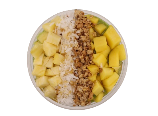 Green smoothie bowl topped with pineapple, mango, granola, and coconut flakes