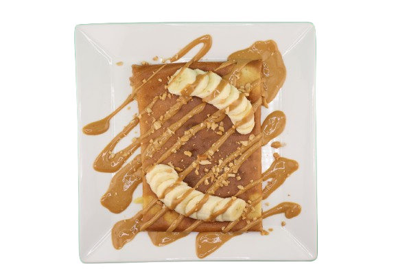 Crepe topped with banana, peanut pieces, and peanut butter